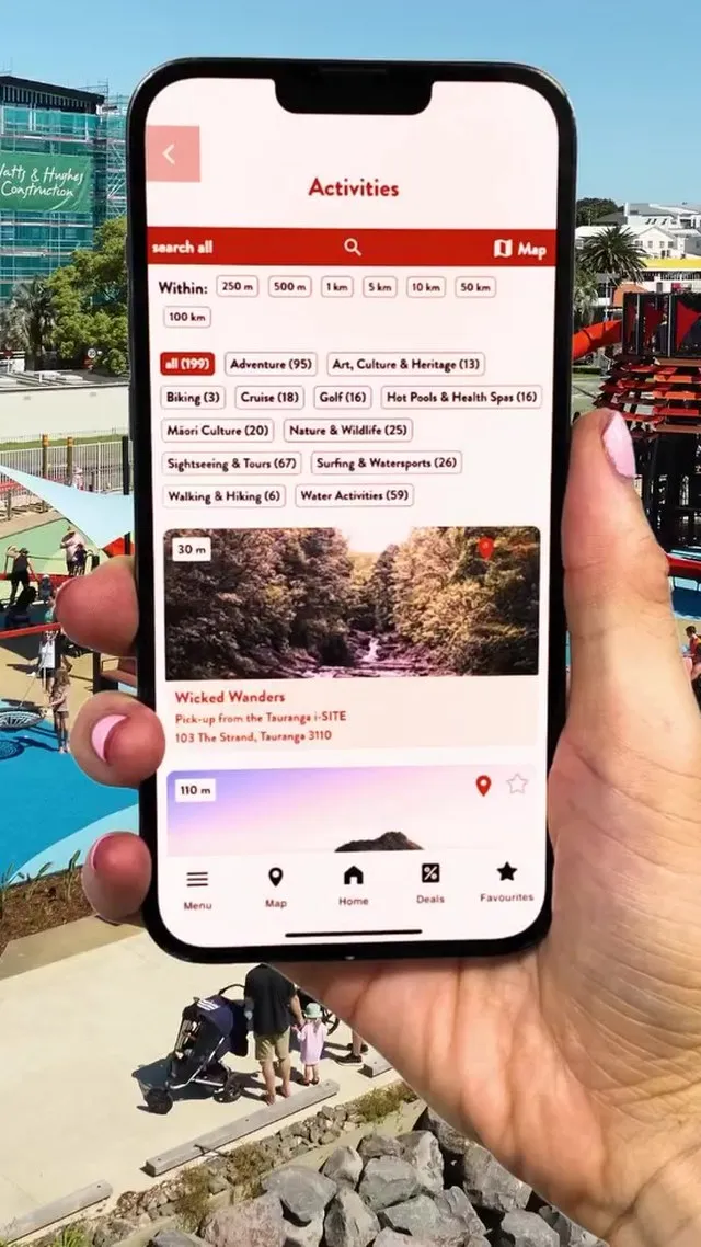 Activities screen with category filters, held up on a sunny waterfront