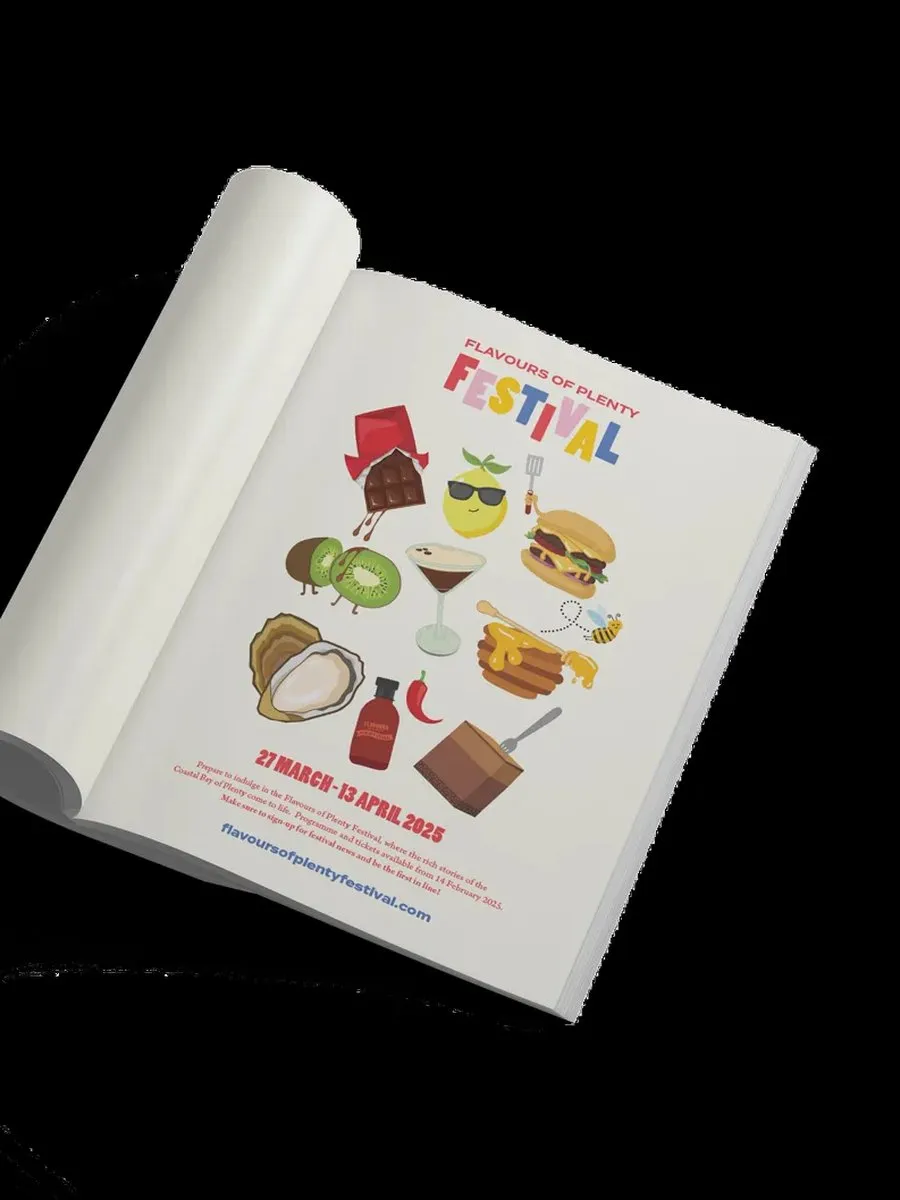 The Flavours of Plenty Festival programme, rolled open on a black background