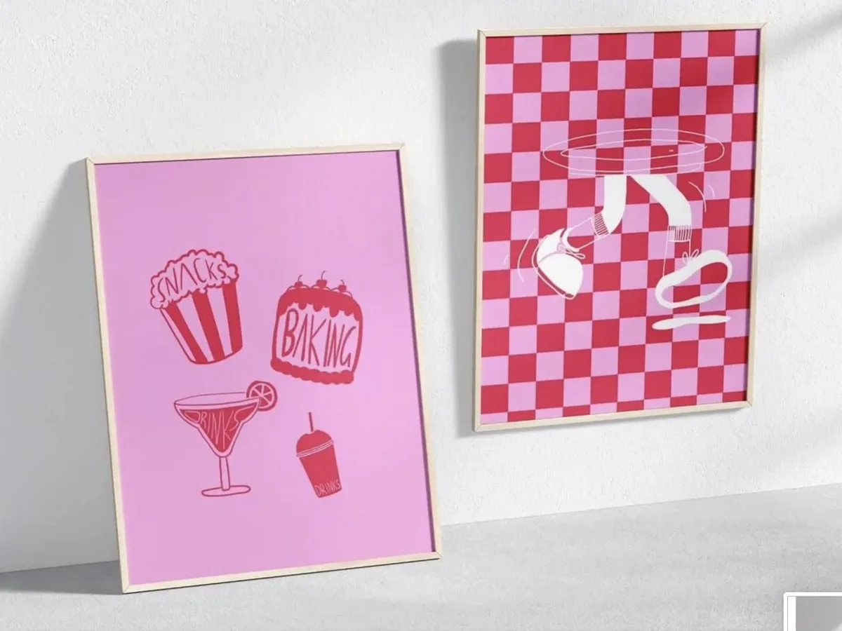 Two framed Empty Plate Club prints: snack illustrations on pink, and a pink checkerboard
