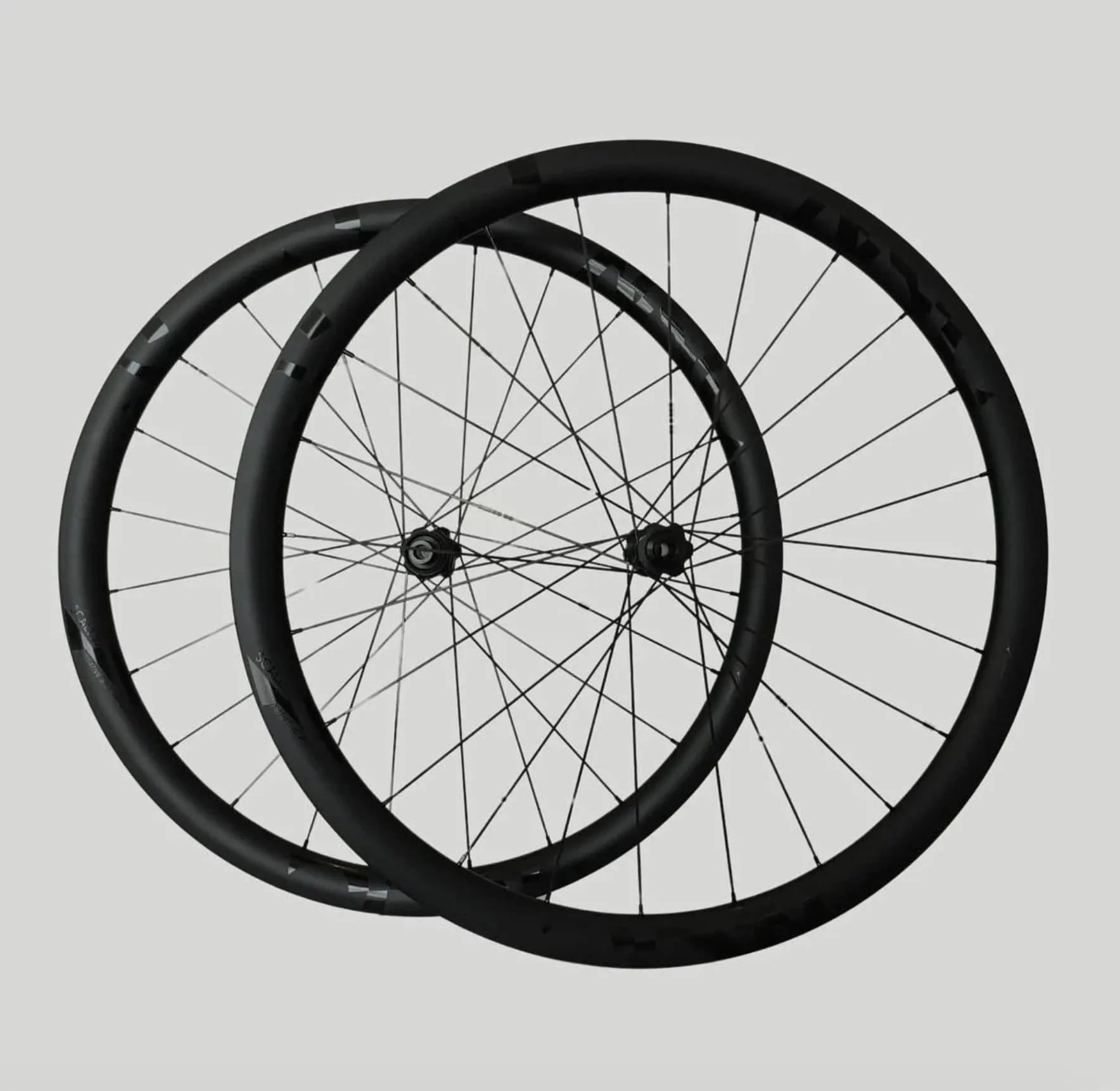 A pair of Negative Split Carbon shallow-rim wheels with tonal black graphics.